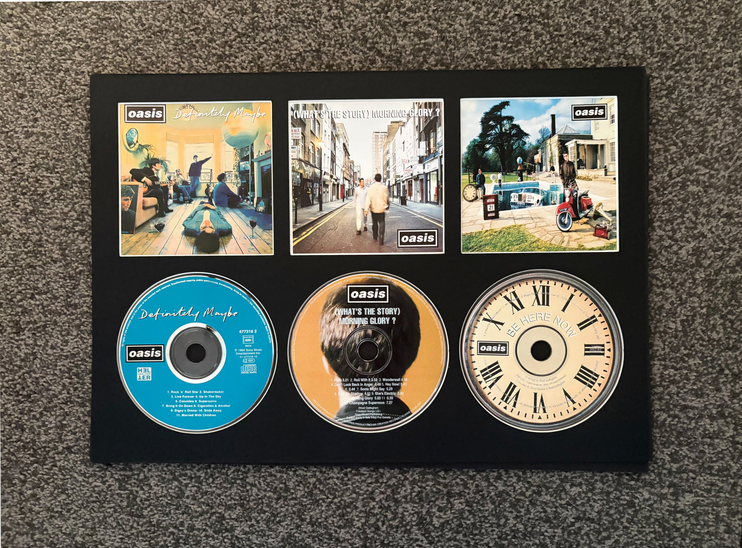 Oasis | Definitely Maybe | What’s The Story (Morning Glory?) | Be Here Now | Triple Retro Mounted CD Wall Display | Frame Not Included |