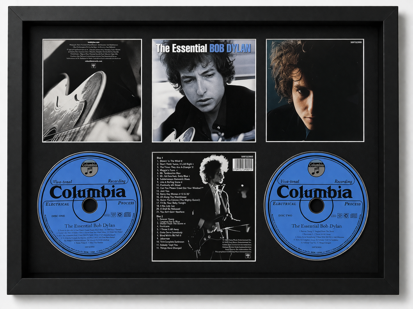 Framed album cover of 'The Essential Bob Dylan' with Columbia records on a black background