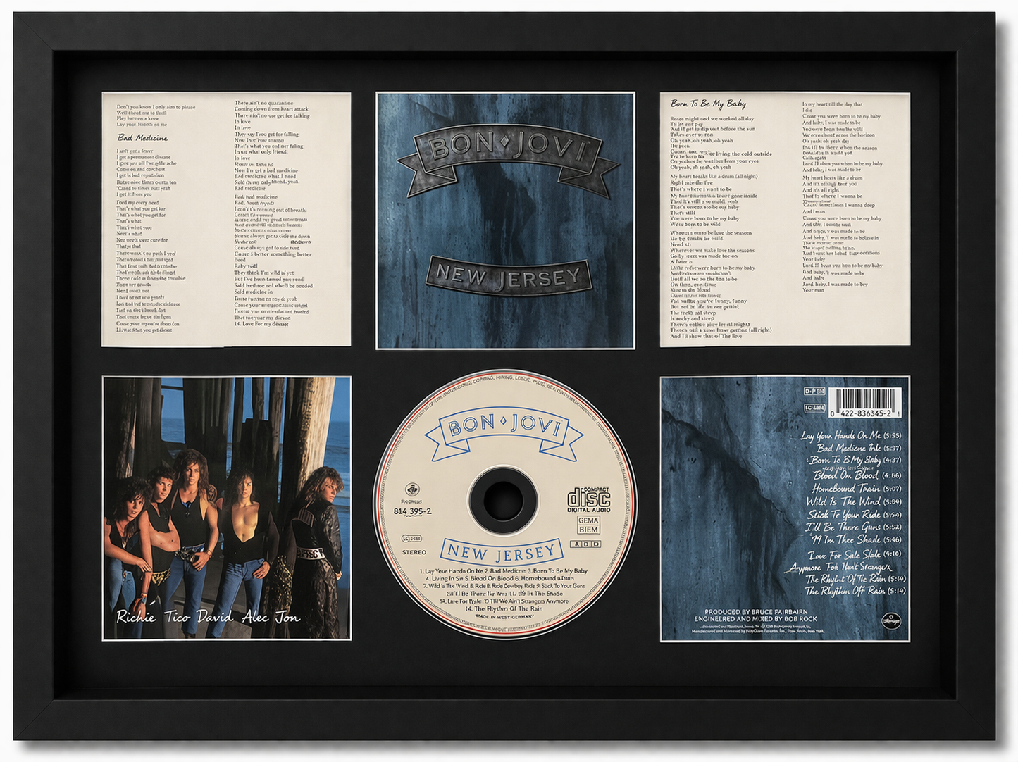 Framed album cover and related items of the band Blur, including a CD and lyrics.