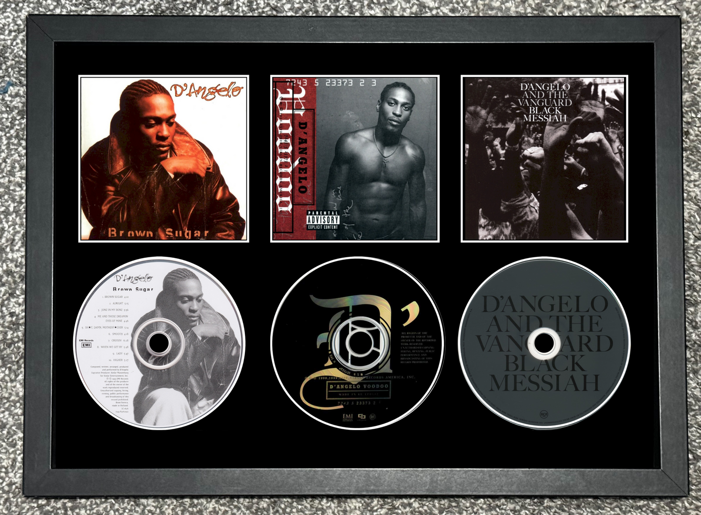 Framed music album cover and CDs with a person on a gray textured background