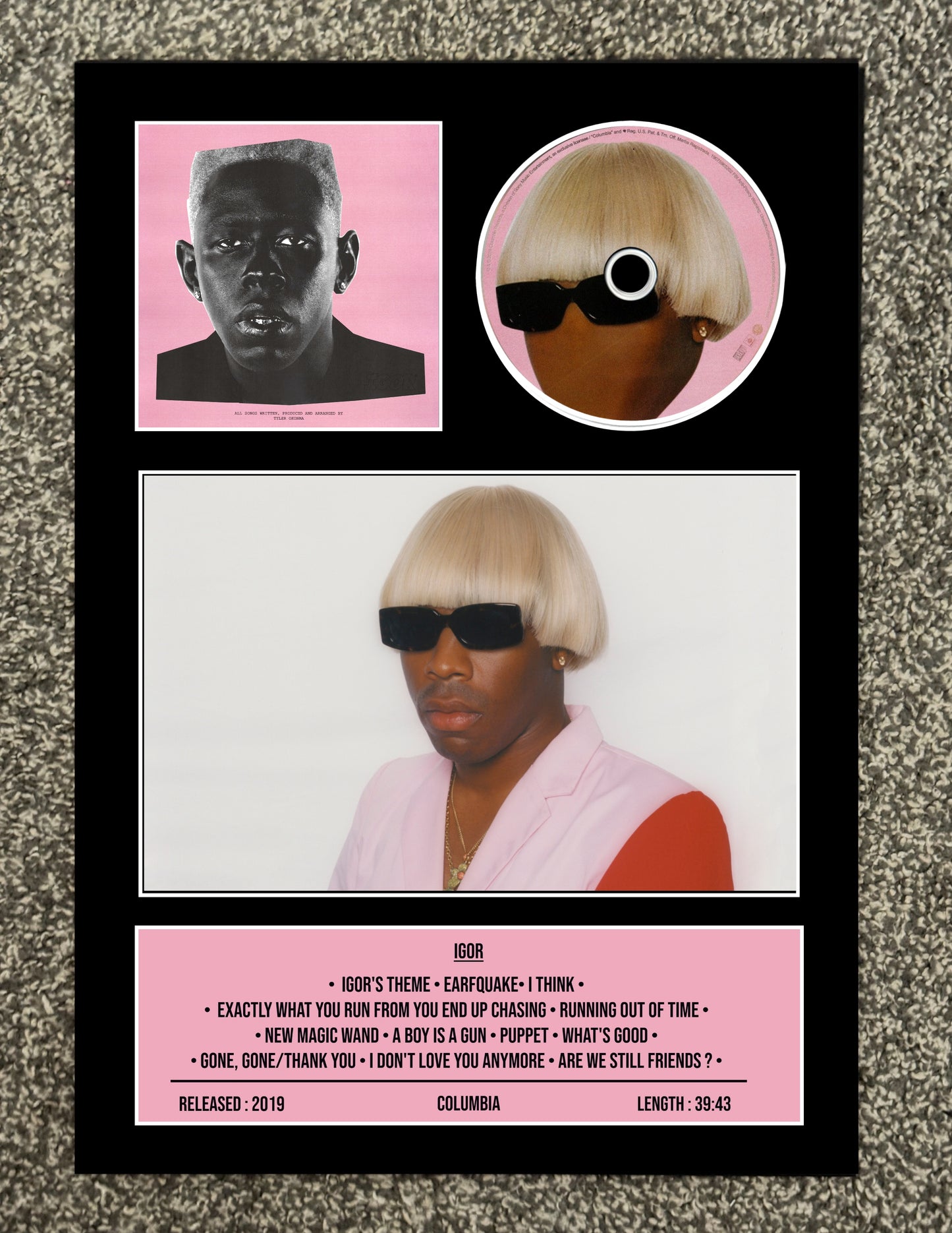 Music album cover with a person wearing sunglasses and a pink sweater, featuring a black border.