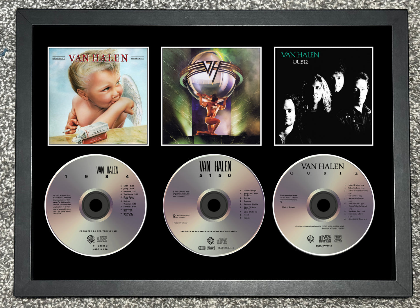 Framed Van Halen music collection with album covers and CDs.