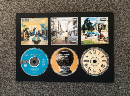 Oasis | Definitely Maybe | What’s The Story (Morning Glory?) | Be Here Now | Triple Retro Mounted CD Wall Display | Frame Not Included |