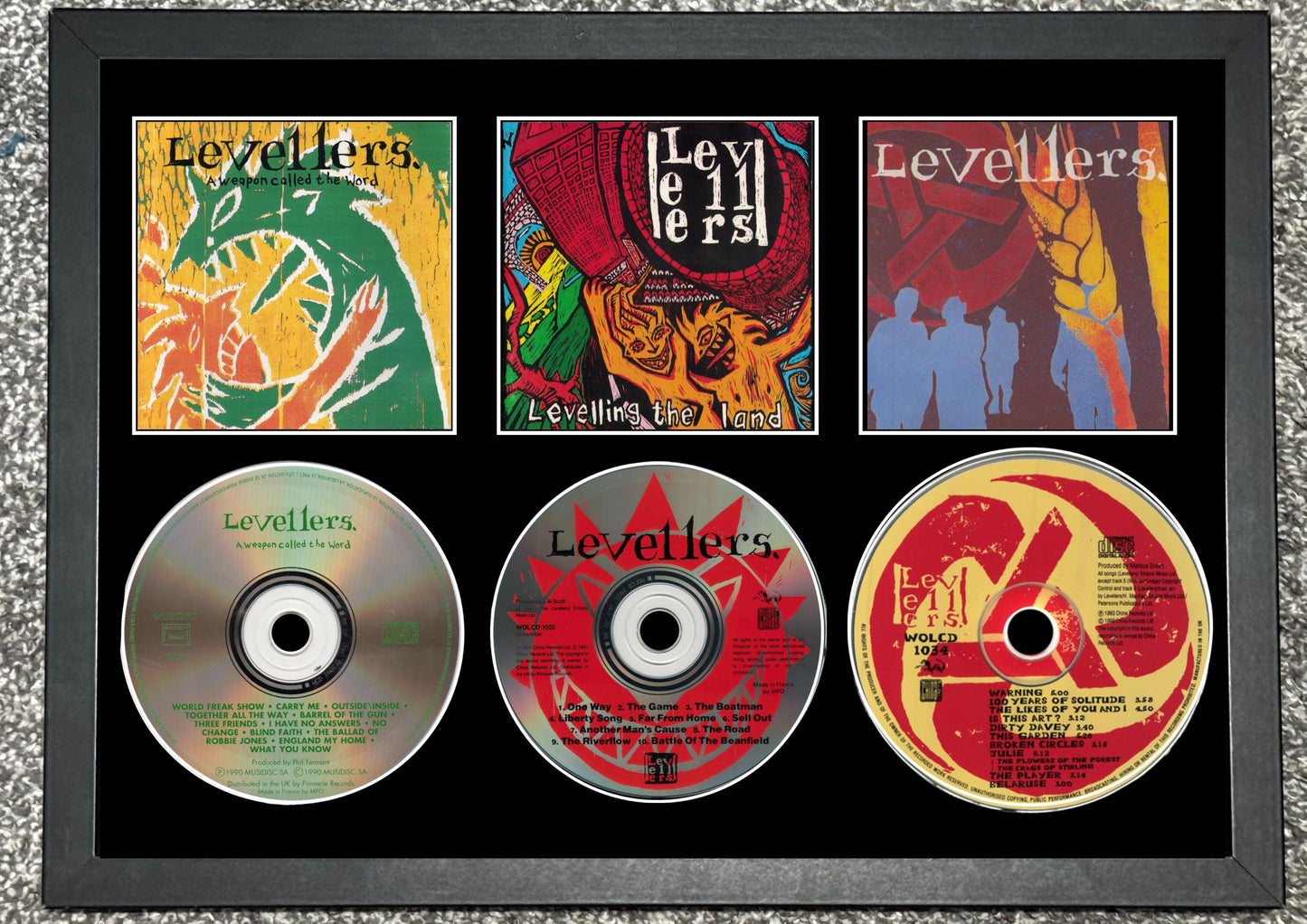 The Levellers | A Weapon Called The World | Levelling The Land | The Levellers | Retro Triple CD Wall Display | Frame Not Included |