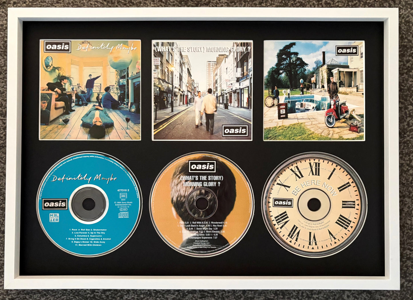 Oasis | Definitely Maybe | What’s The Story (Morning Glory?) | Be Here Now | Triple Retro Mounted CD Wall Display | Frame Not Included |