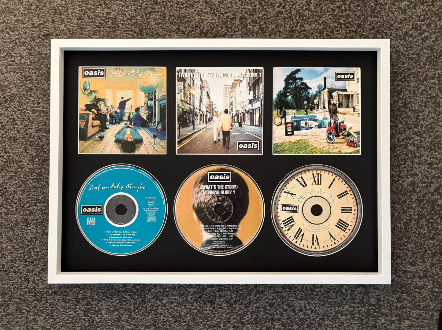 Oasis | Definitely Maybe | What’s The Story (Morning Glory?) | Be Here Now | Triple Retro Mounted CD Wall Display | Frame Not Included |