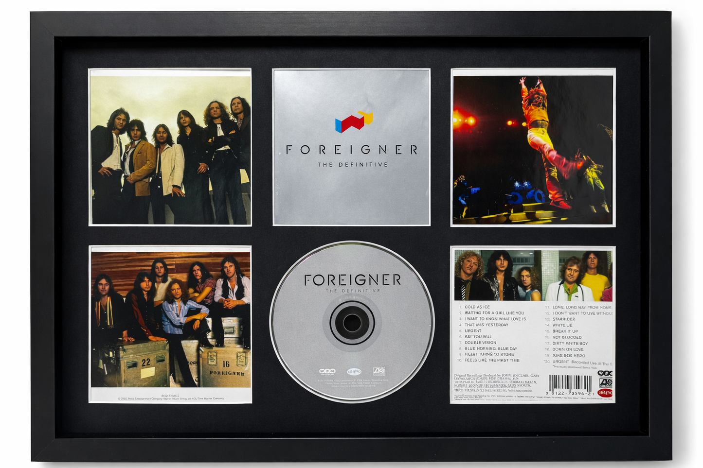 Framed Foreigner album collectible with CD and photos