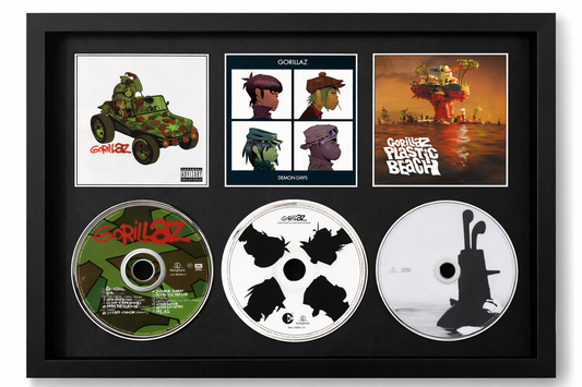 Framed Gorillaz music album cover and CDs with a black border.