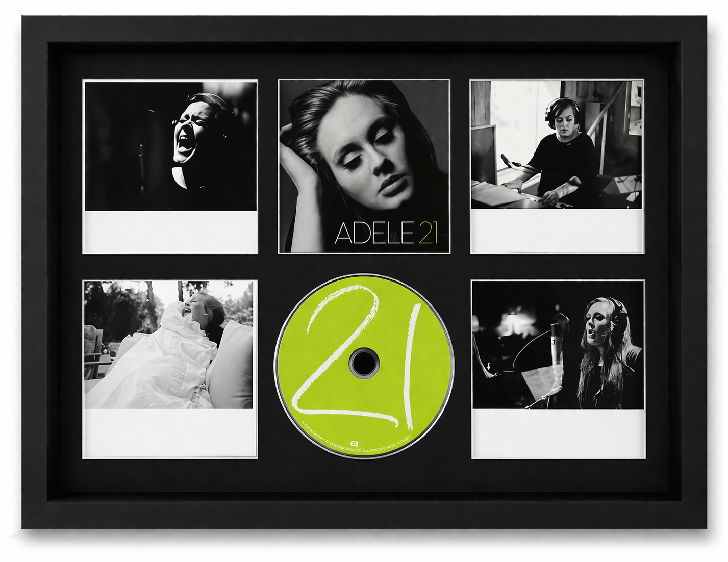 Framed collage with black and white photos and a green '21' CD cover