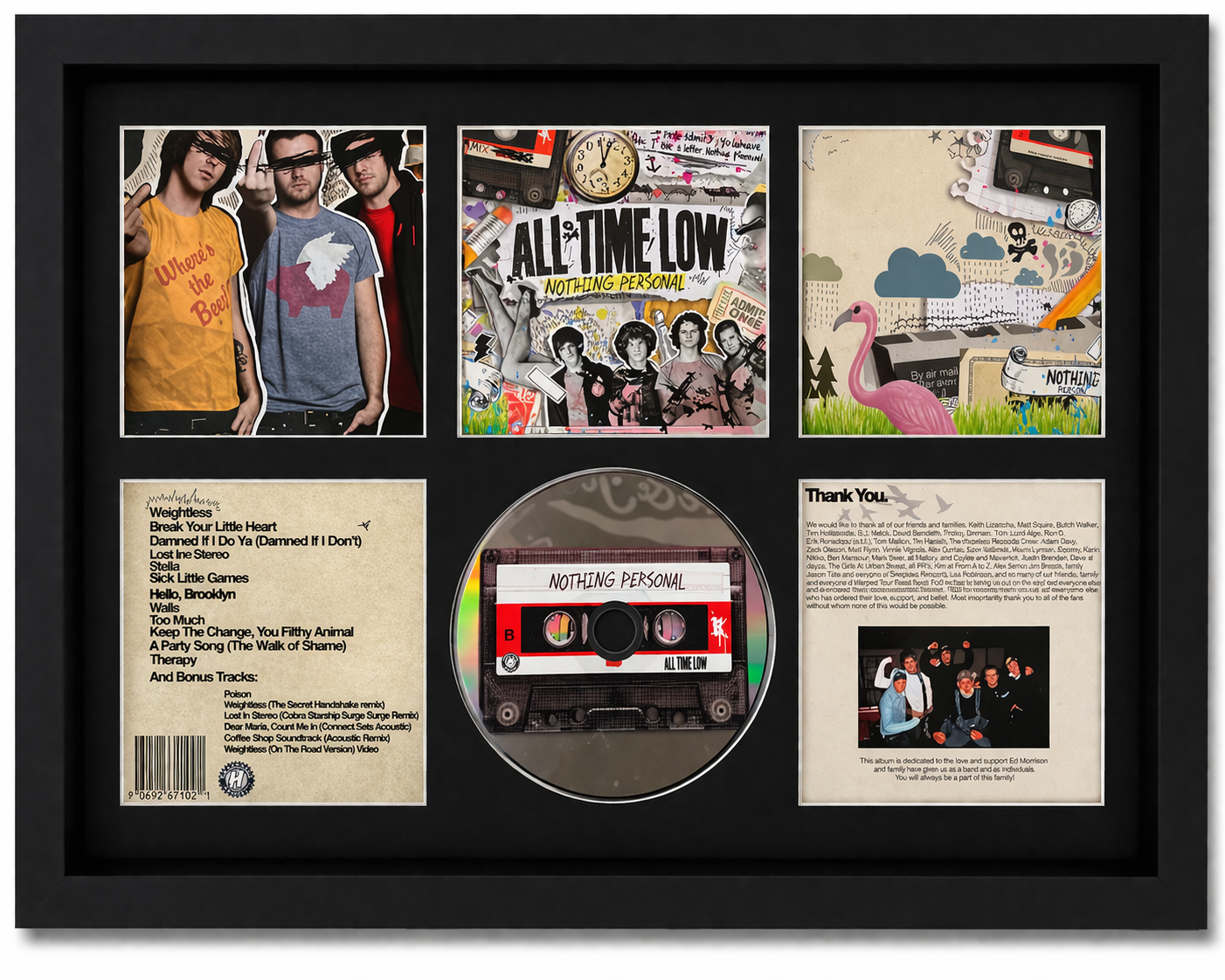 Framed display of a music album cover with a cassette tape and additional images.