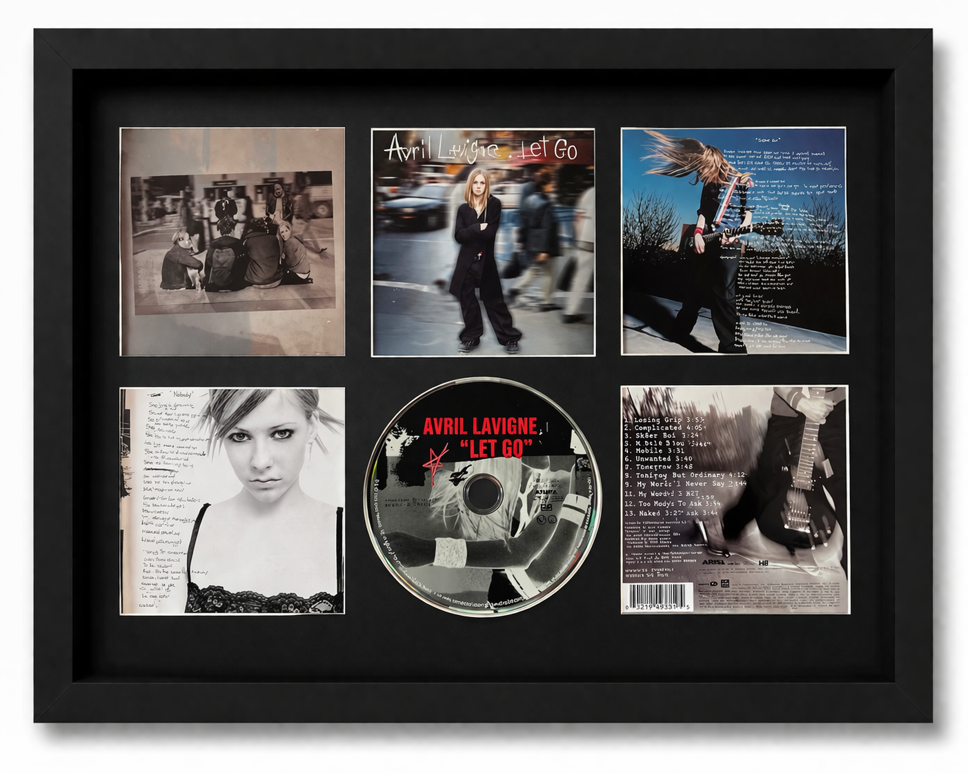 Framed Avril Lavigne 'Let Go' album with multiple images and a CD inside