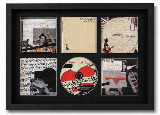 Framed collage with album cover, photos, and text on a black background