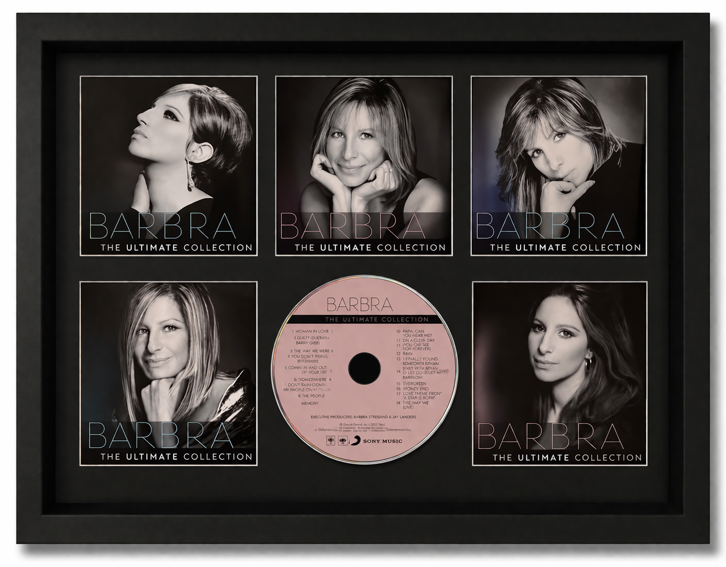 Framed album cover of 'Barbra: The Ultimate Collection' with black and white portraits and a pink CD.