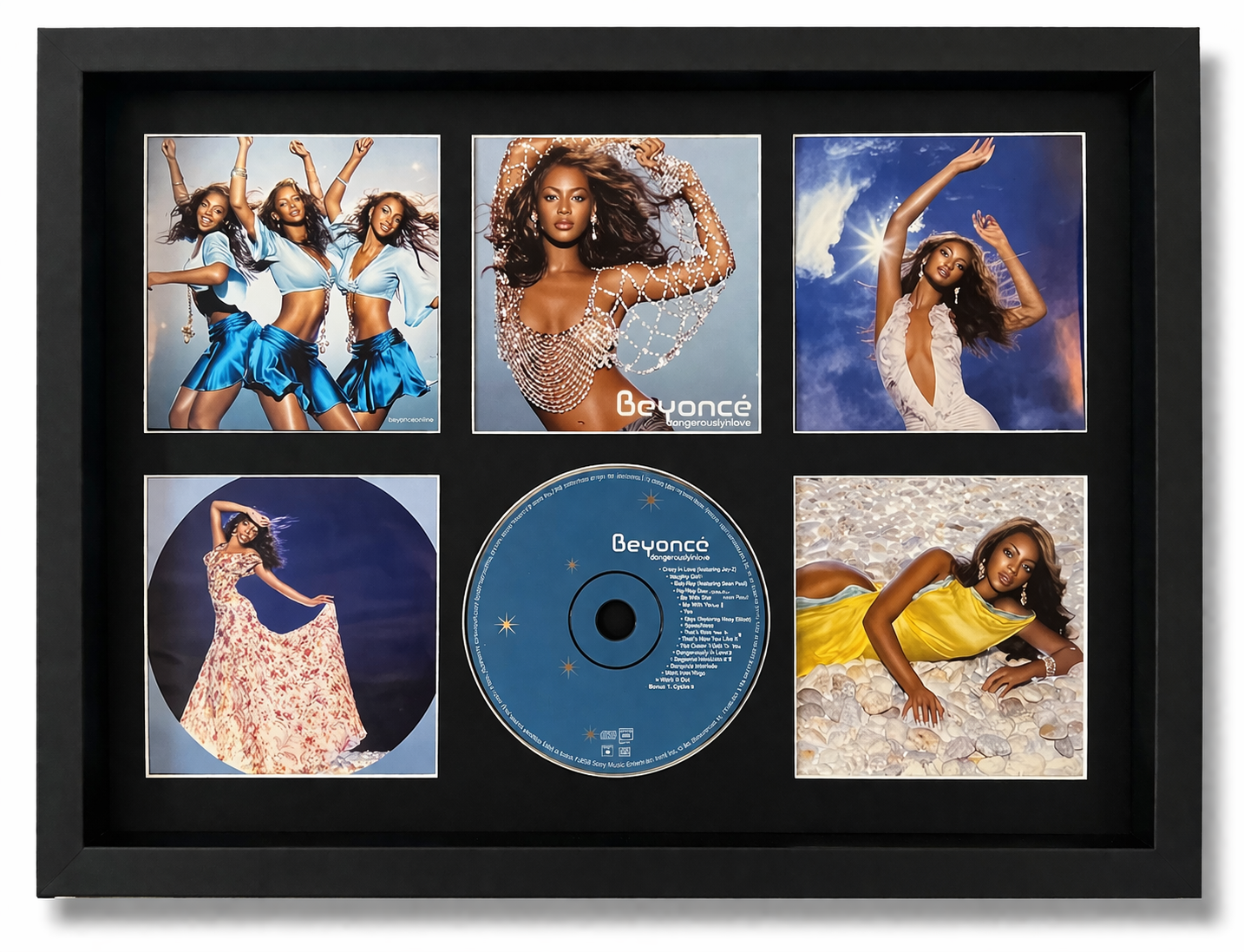 Framed Beyoncé album cover with five images and a CD inside