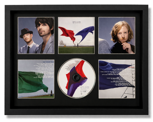 Framed music album cover with portraits and a CD inside