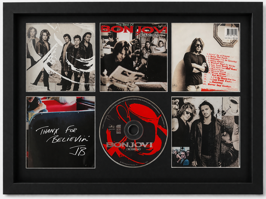 Framed album cover and related items of the band Blur, including a CD and lyrics.