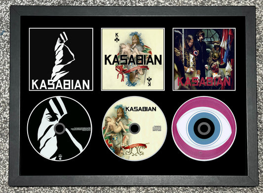 Framed collage of Kasabian album covers and logo on a textured surface