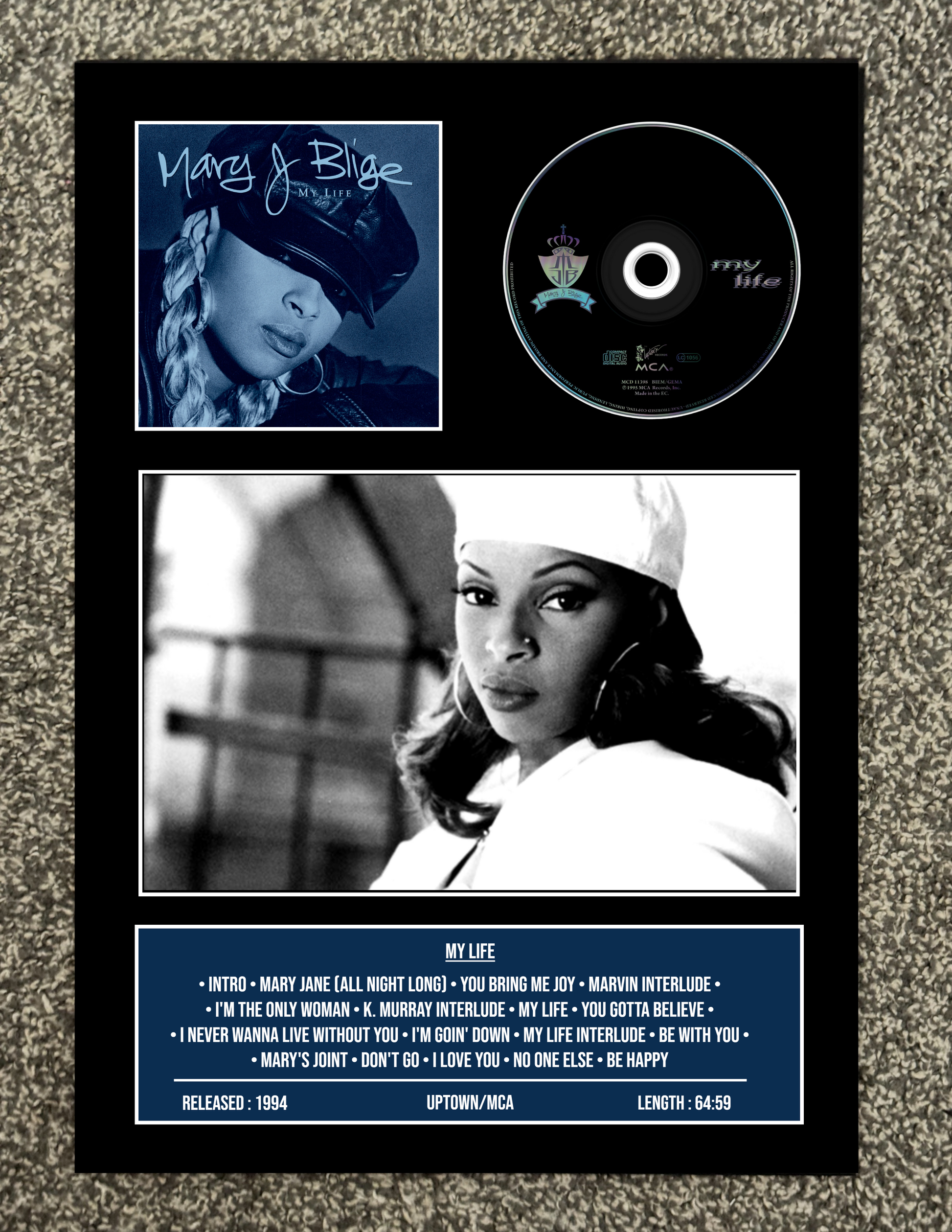 Album cover with Mary J. Blige featuring a photo, CD, and tracklist on a textured surface.