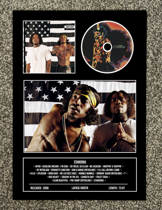 CD cover with American flag design, images of people, and tracklist on a textured surface.