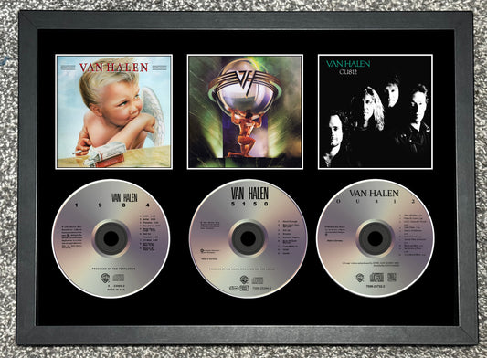 Framed Van Halen music collection with album covers and CDs.
