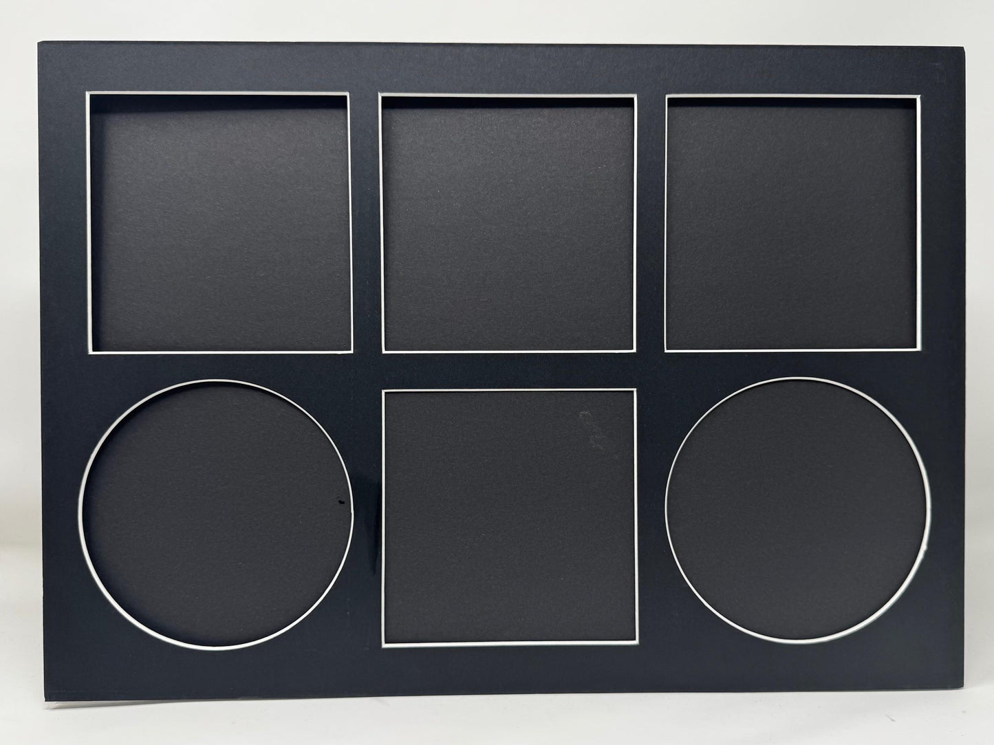 Black photo frame with geometric shapes on a white background