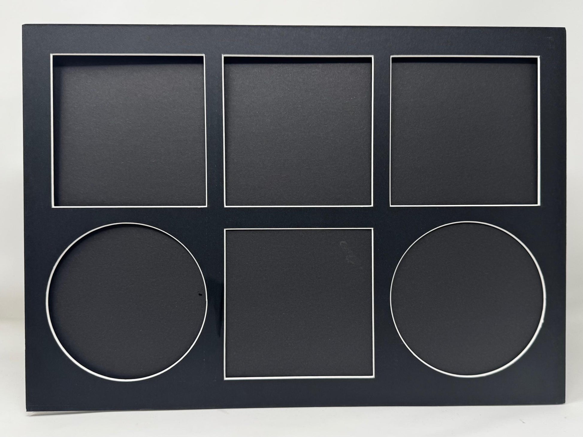 Black photo frame with geometric shapes on a white background